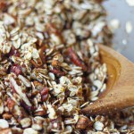 easy homemade vegan granola in a bowl with wooden spoon