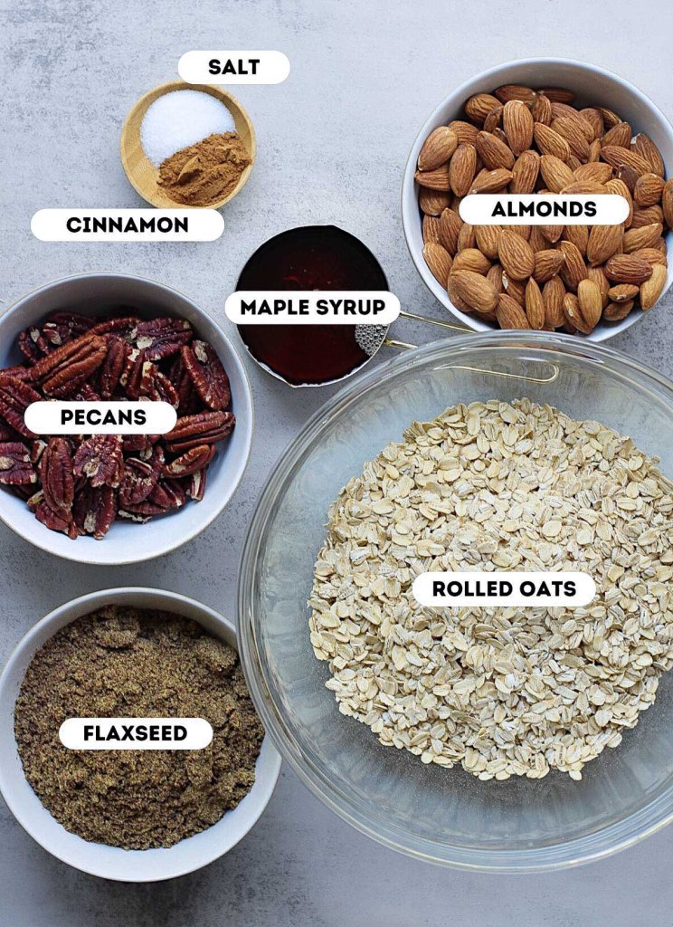 easy homemade vegan Granola ingredients in individual bowls on a white gray background