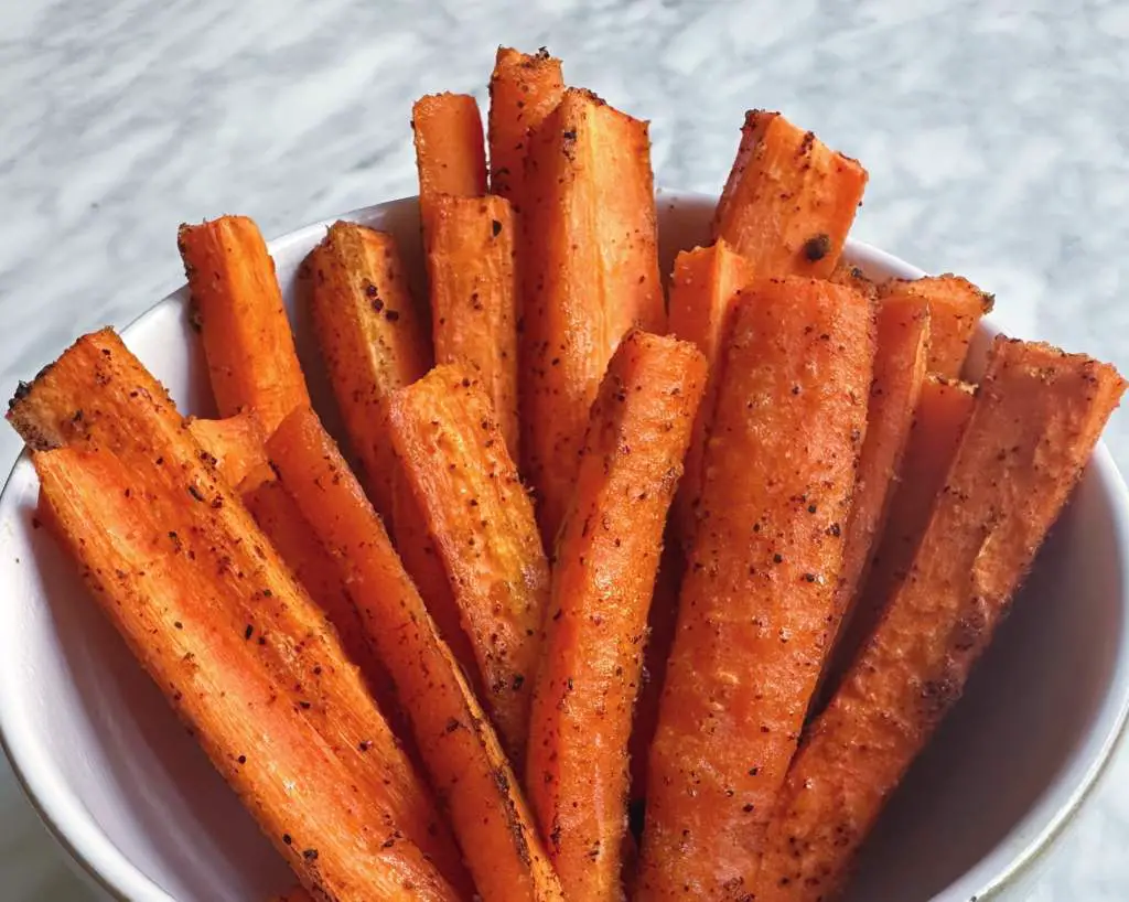 Finished carrot fries in a white bowl