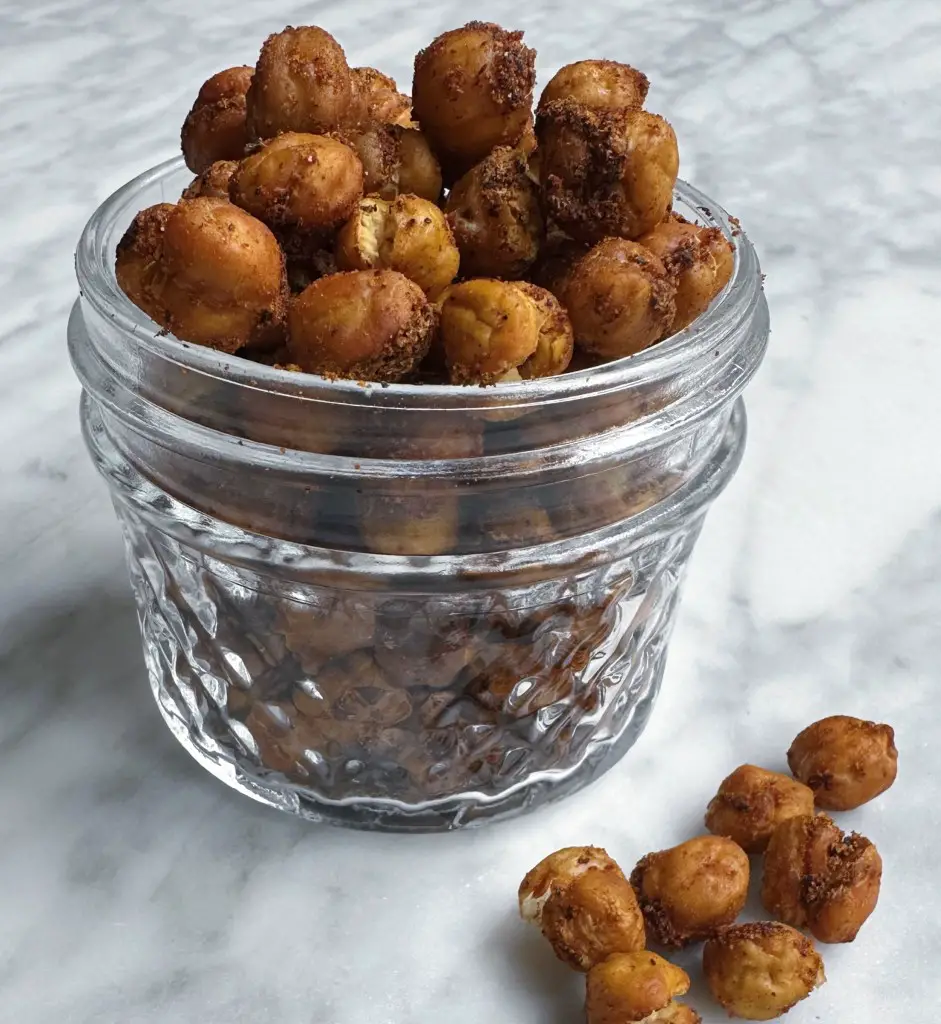 Finished Crunchy Baked Chickpeas in a glass jar