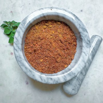 homemade vegan taco seasoning in a white marble bowl