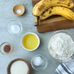 ingredients for vegan banana bread on a grey background