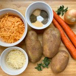 ingredients for vegan baked potato soup on a cutting board