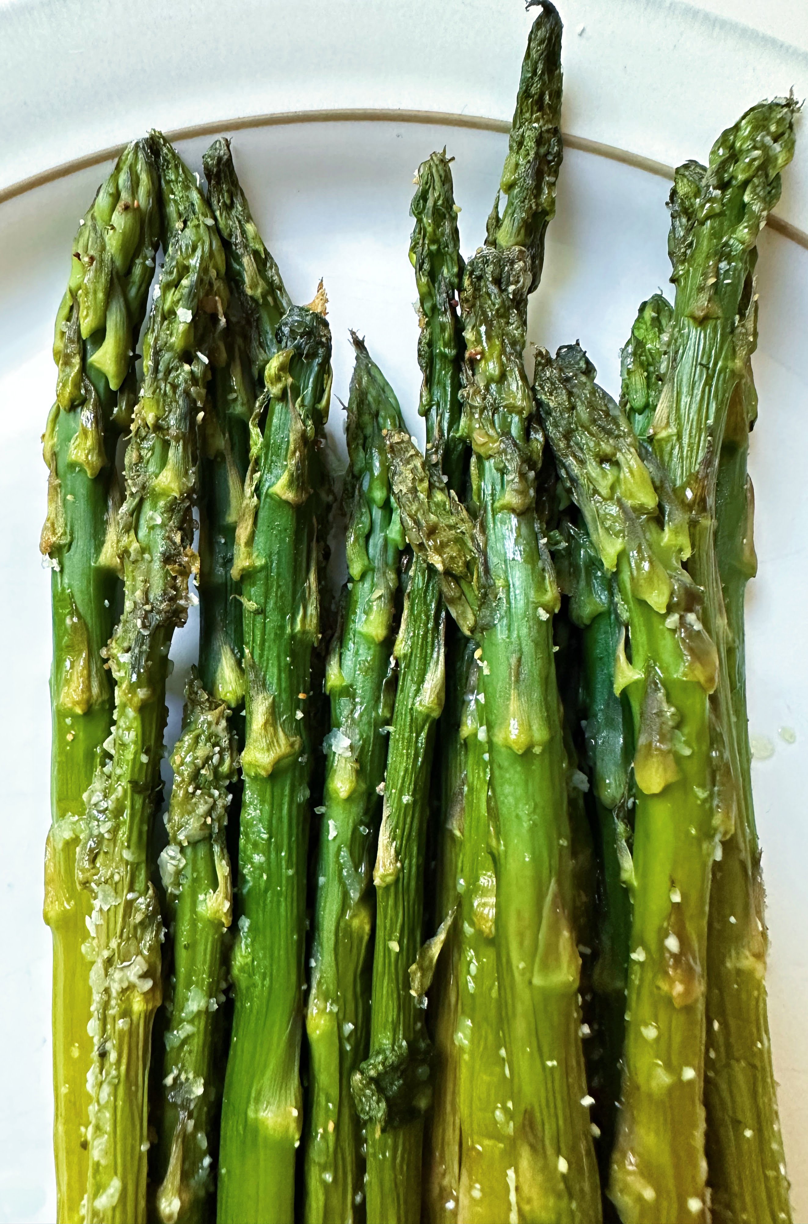 Finished garlic Roasted asparagus on a plate