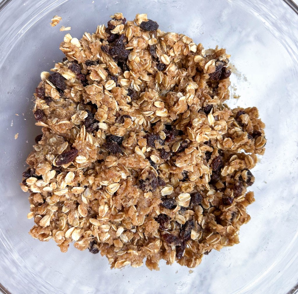 Uncooked dough for vegan oatmeal raisin cookies