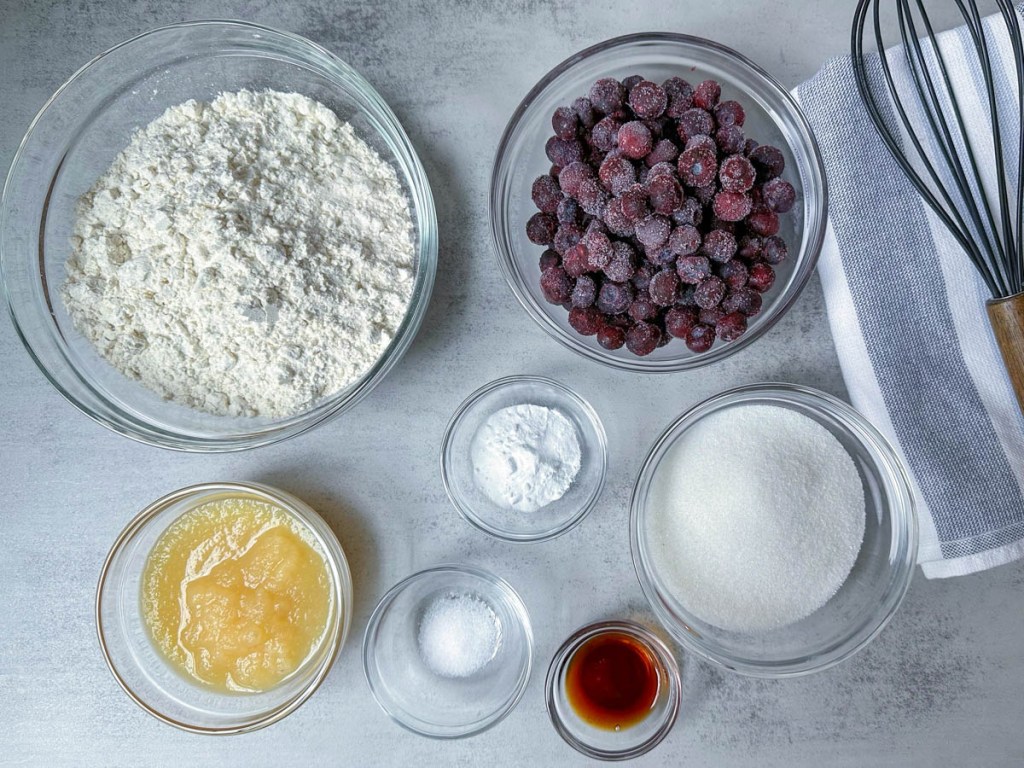 ingredients for vegan blueberry muffins on a grey background