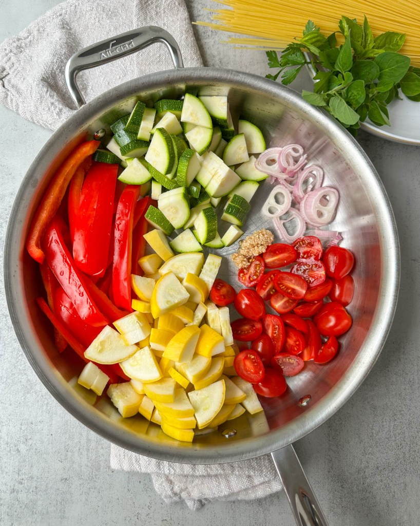 chopped veggies in a sauté pan
