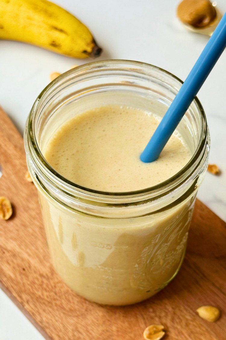finished vegan banana oat smoothie in a glass mason jar