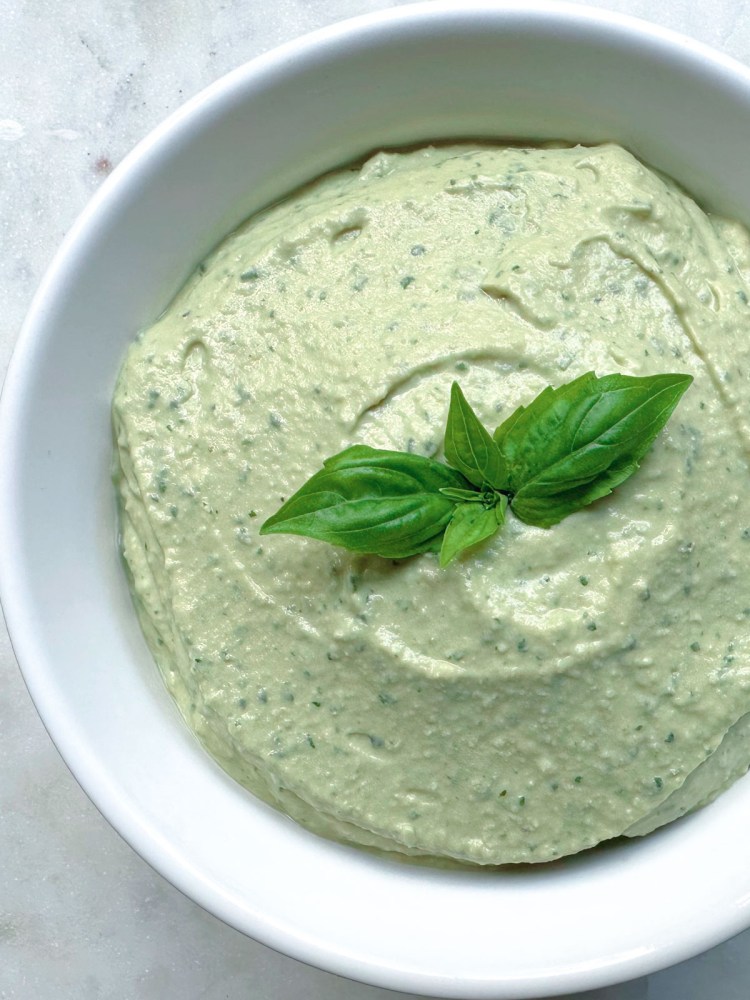 finished bowl of basil lemon hummus