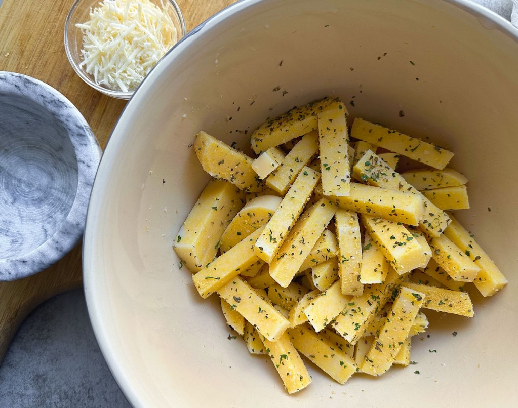 uncooked polenta fries coated in spices