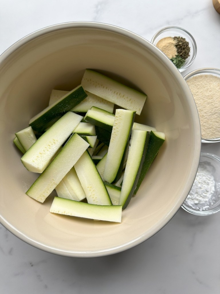 cut spears in a bowl before breading