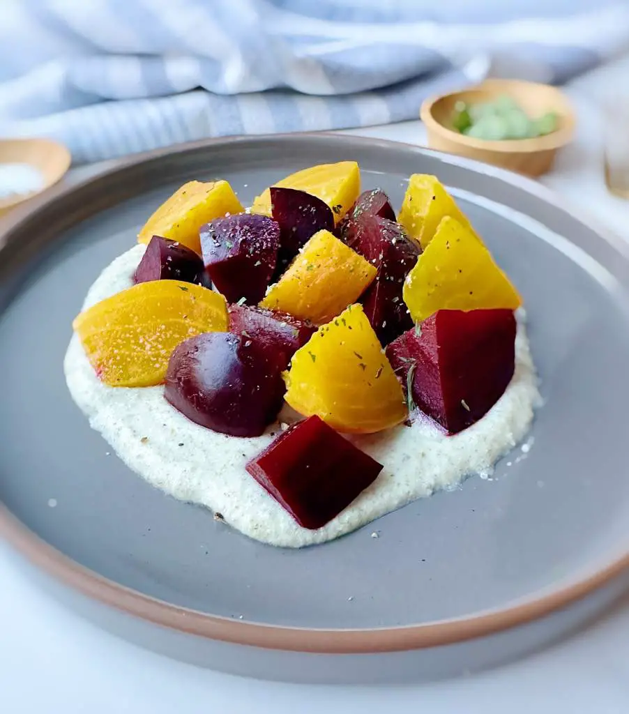 Golden Beet Salad with Vegan Whipped Feta dip on a plate