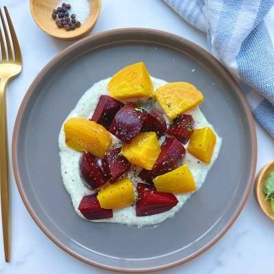 Finished plate of golden beet salad with vegan whipped feta dip