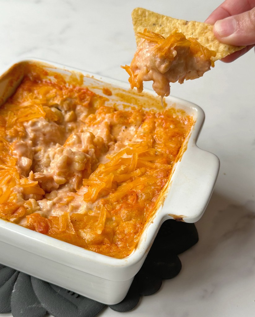 finished buffalo chickpea dip with scoop taken out