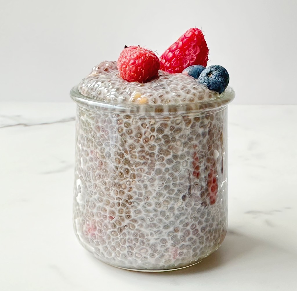 finished vegan chia seed pudding topped with berries