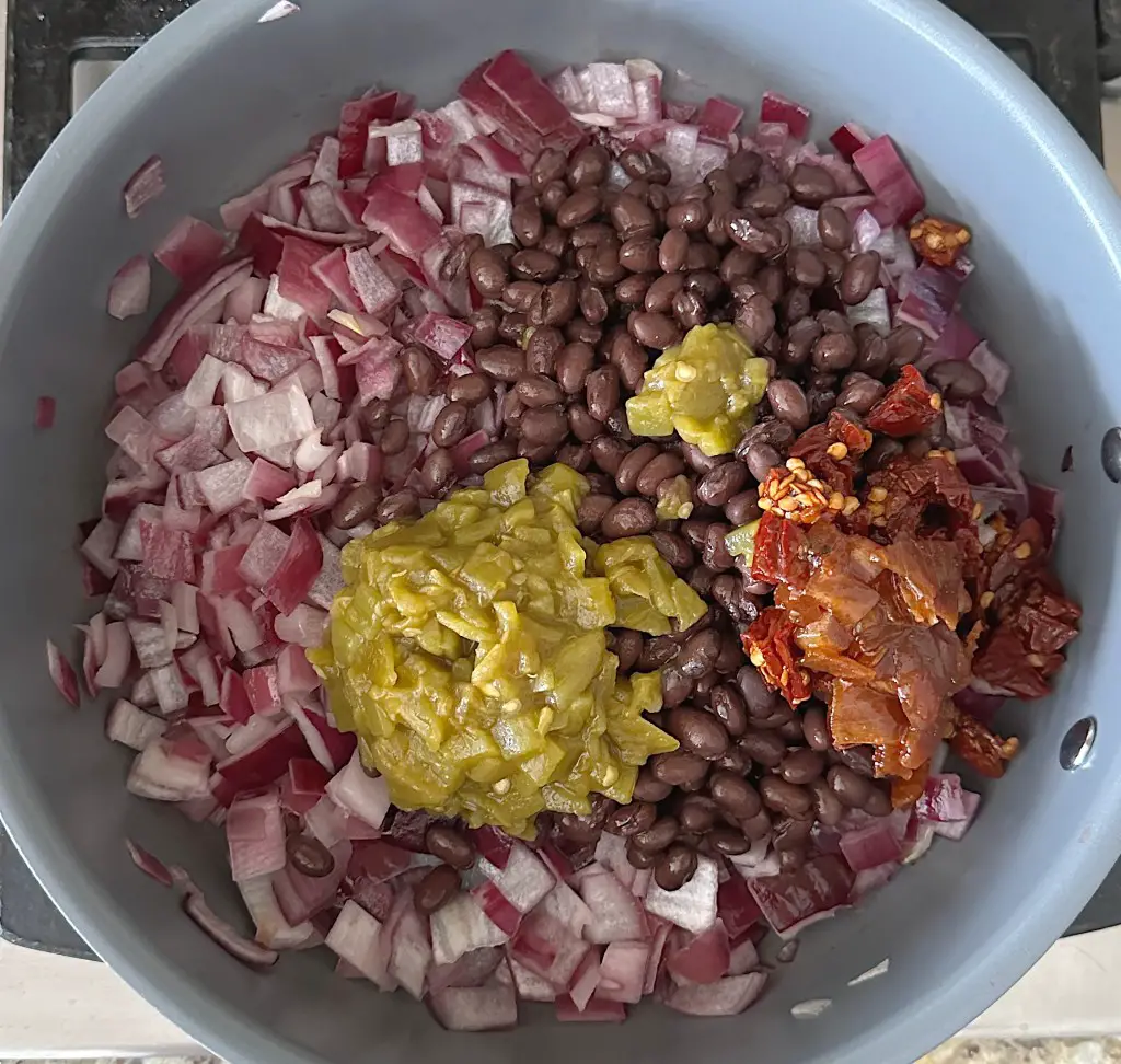 ingredients for chipotle style black beans in pot not mixed