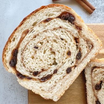 close up view single slice cinnamon raisin bread