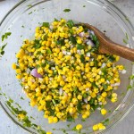 corn salsa mixed in mixing bowl