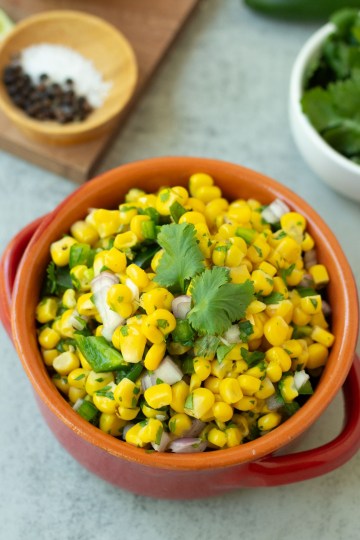 finished corn salsa topped with fresh cilantro