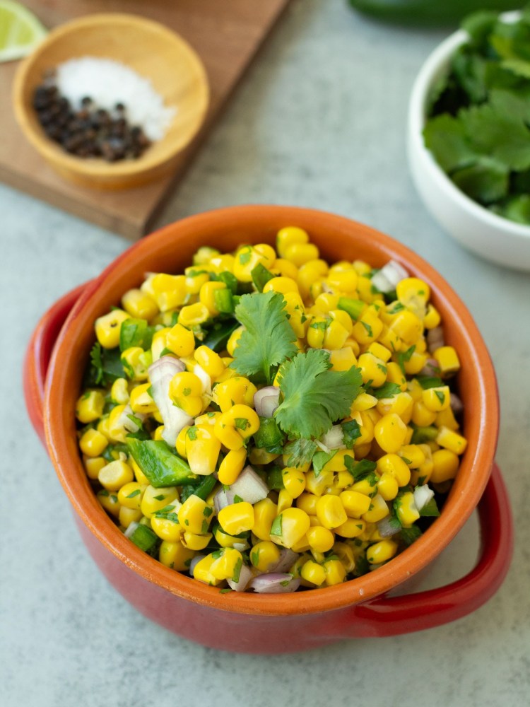 finished corn salsa topped with fresh cilantro