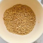 ingredients for easy vegan graham cracker pie crust recipe in a mixing bowl