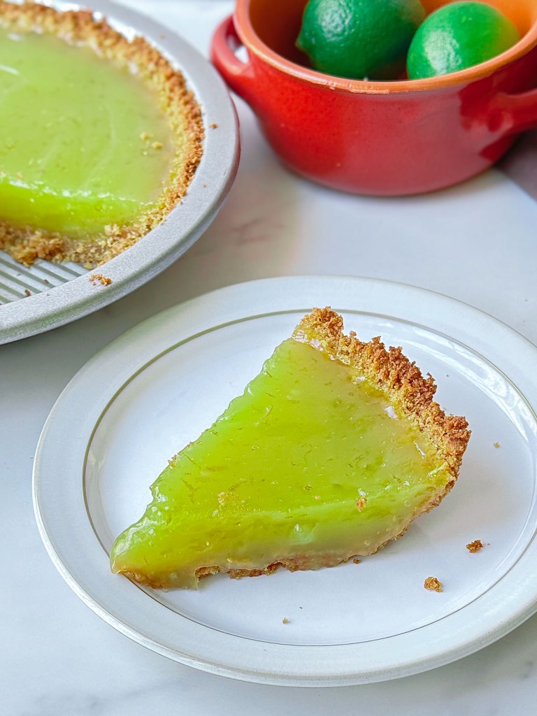slice of key lime tart with graham cracker crust