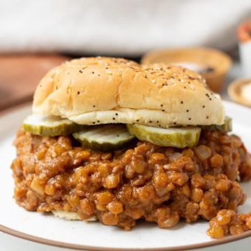 finished lentil sloppy joes on sandwich with pickles