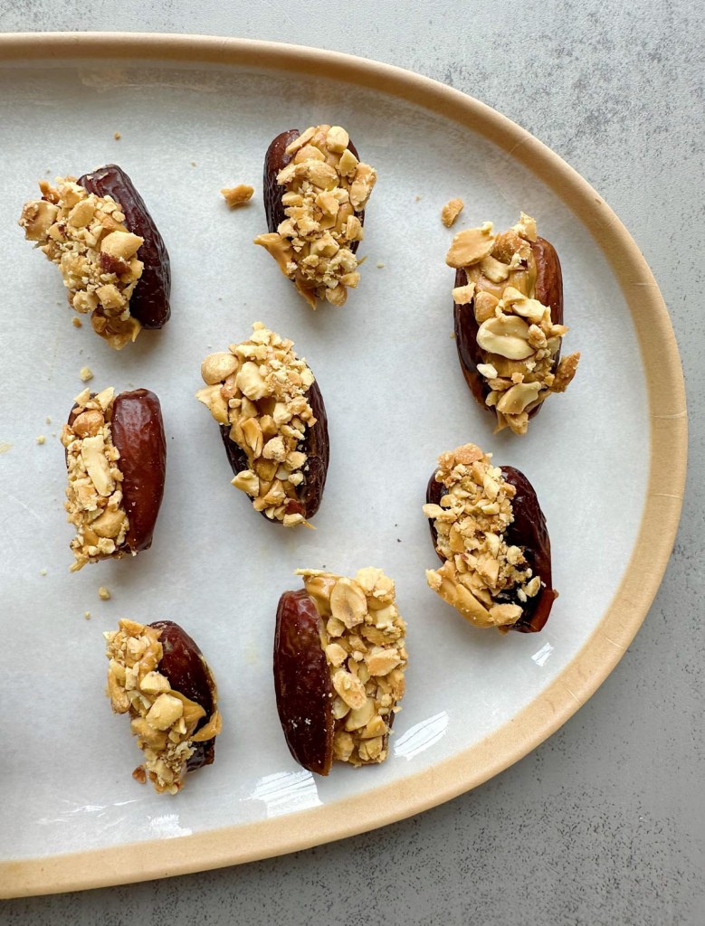 Crunchy peanut butter stuffed dates before being coated with chocolate