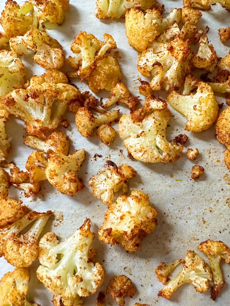 uncooked cauliflower on roasting sheet