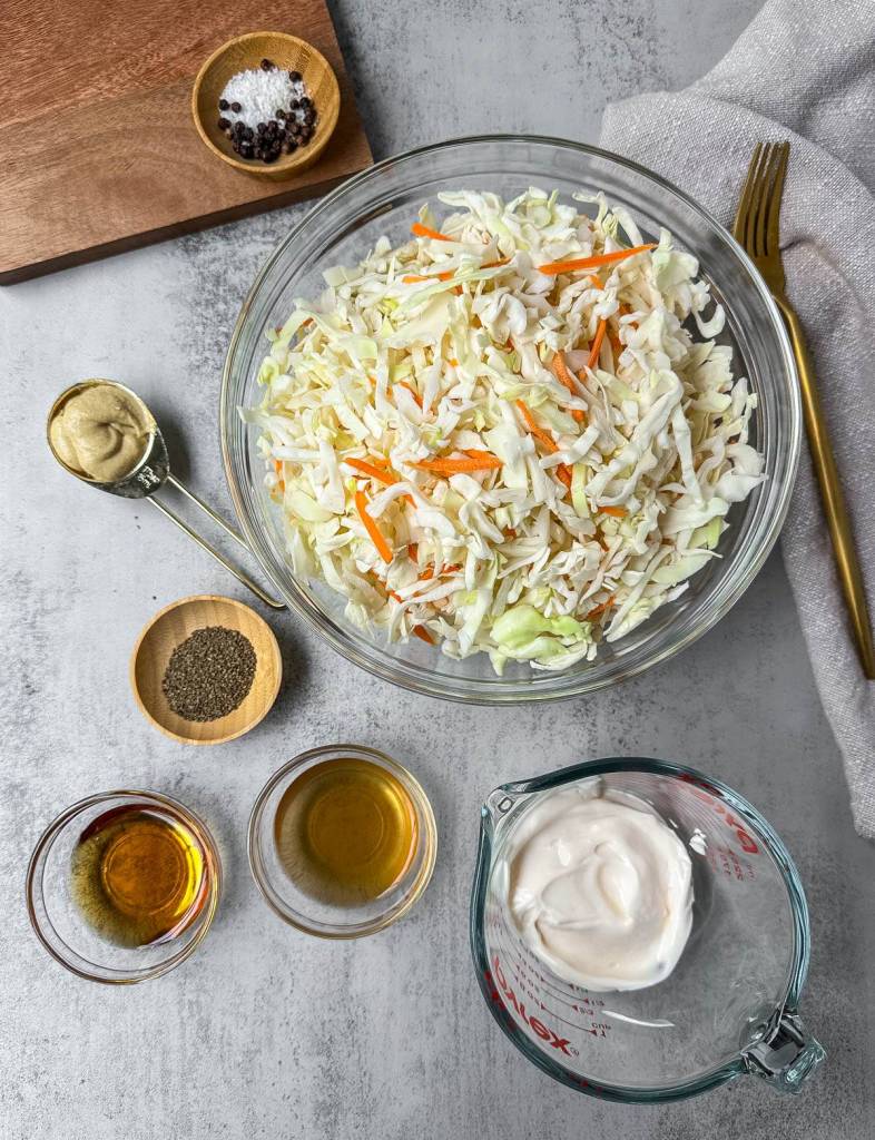 ingredients for vegan coleslaw on a grey background