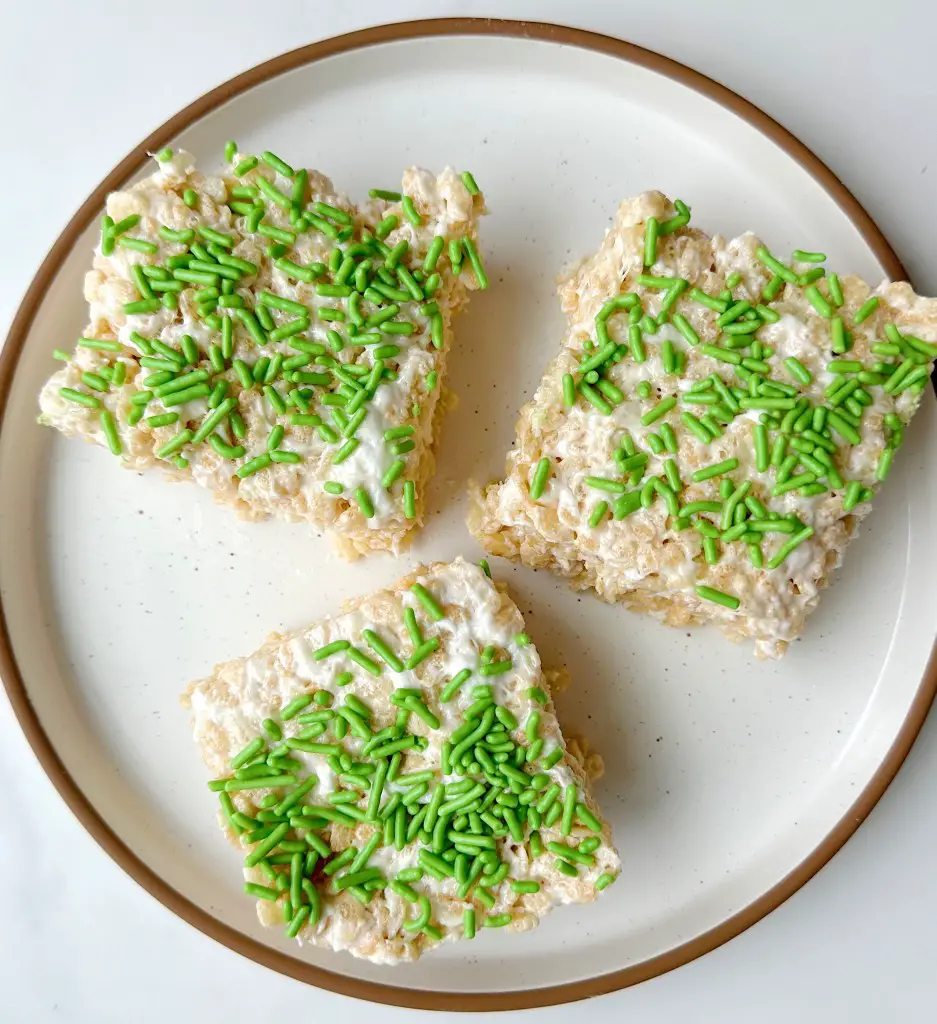 vegan rice krispie treats decorated with green sprinkles