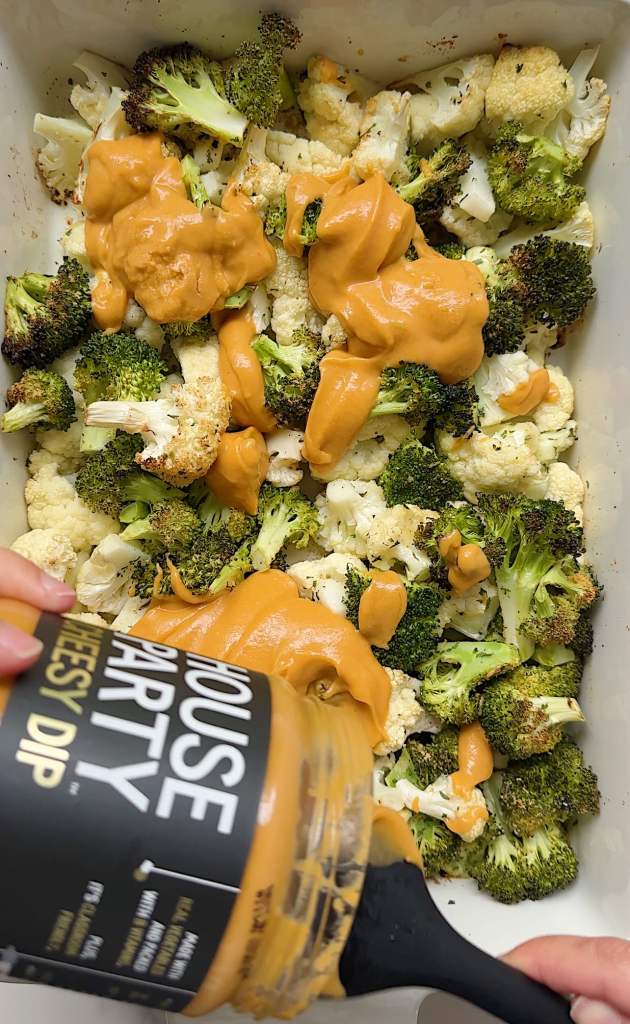 vegan broccoli cheddar casserole with house party dip being mixed in