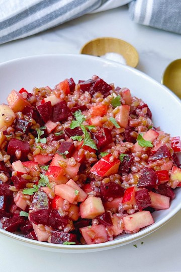 angle view of finished beet apple farro salad