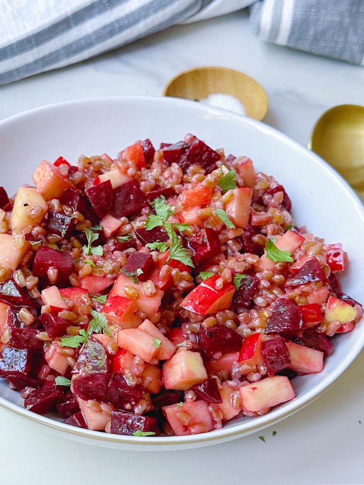 angle view of finished beet apple farro salad