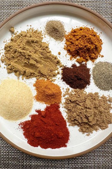 shawarma spice blend with all spices separated on a plate