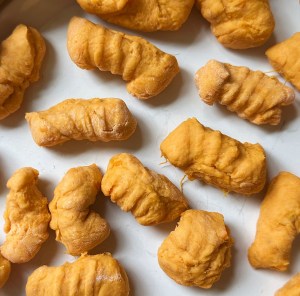 close up of raw, shaped vegan sweet potato gnocchi