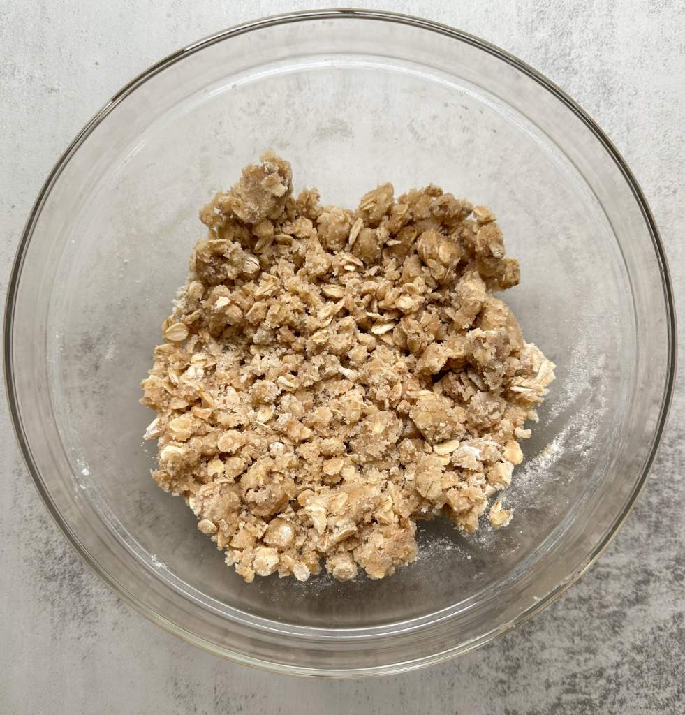 apple pie crumble bars crumb topping in a glass bowl