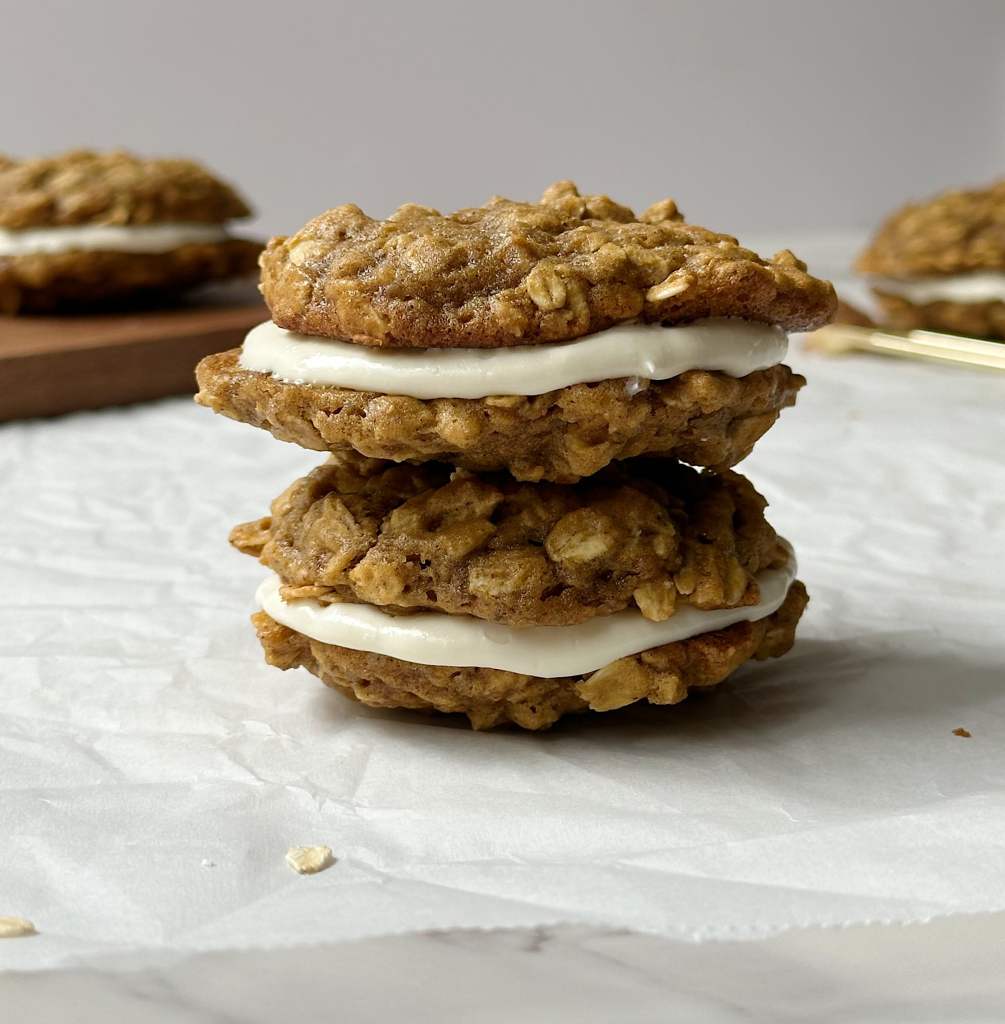 two vegan pumpkin spice oatmeal creme pies stacked on one another