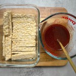 ingredients for smoky maple tempeh bacon on a wooden cutting board