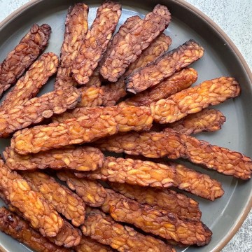 tempeh bacon arranged on a plate