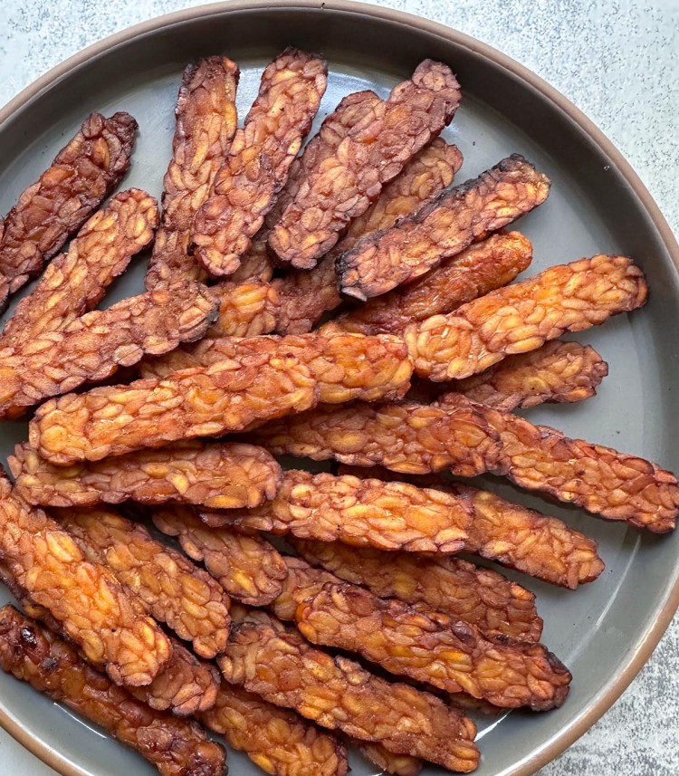 tempeh bacon arranged on a plate
