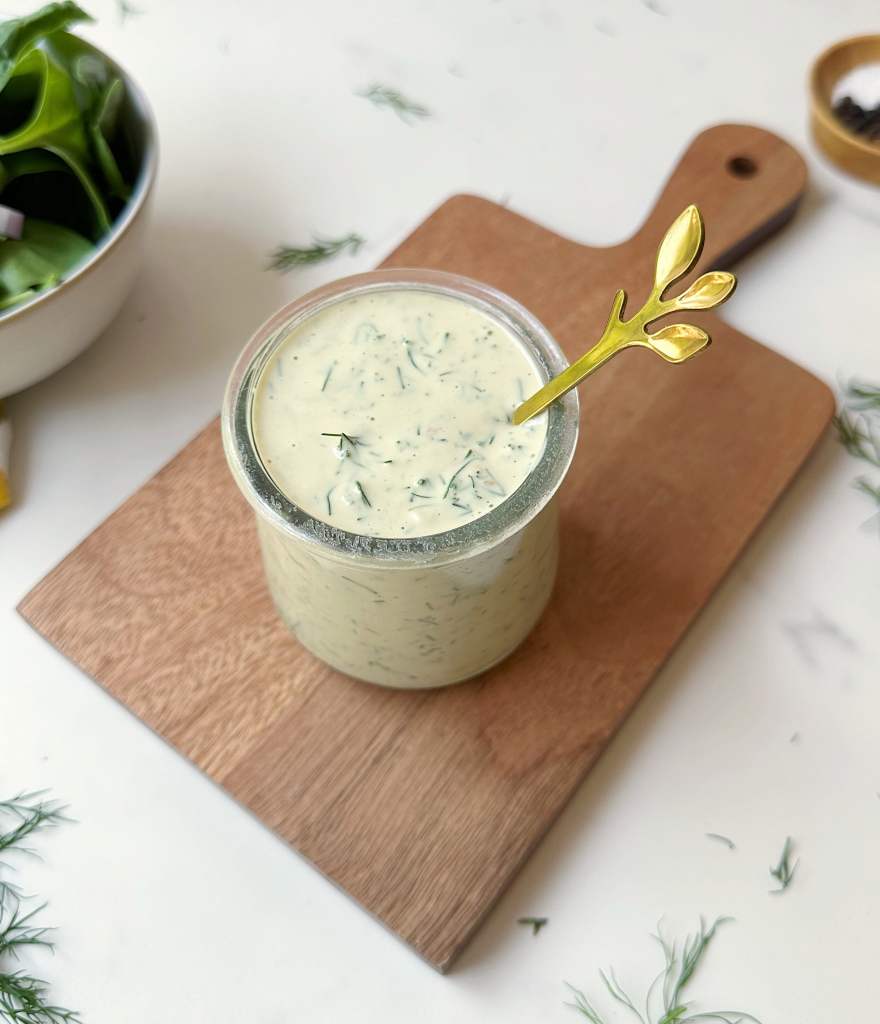 vegan dill tahini dressing in a small glass jar