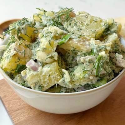 vegan dill potato salad in a small white bowl