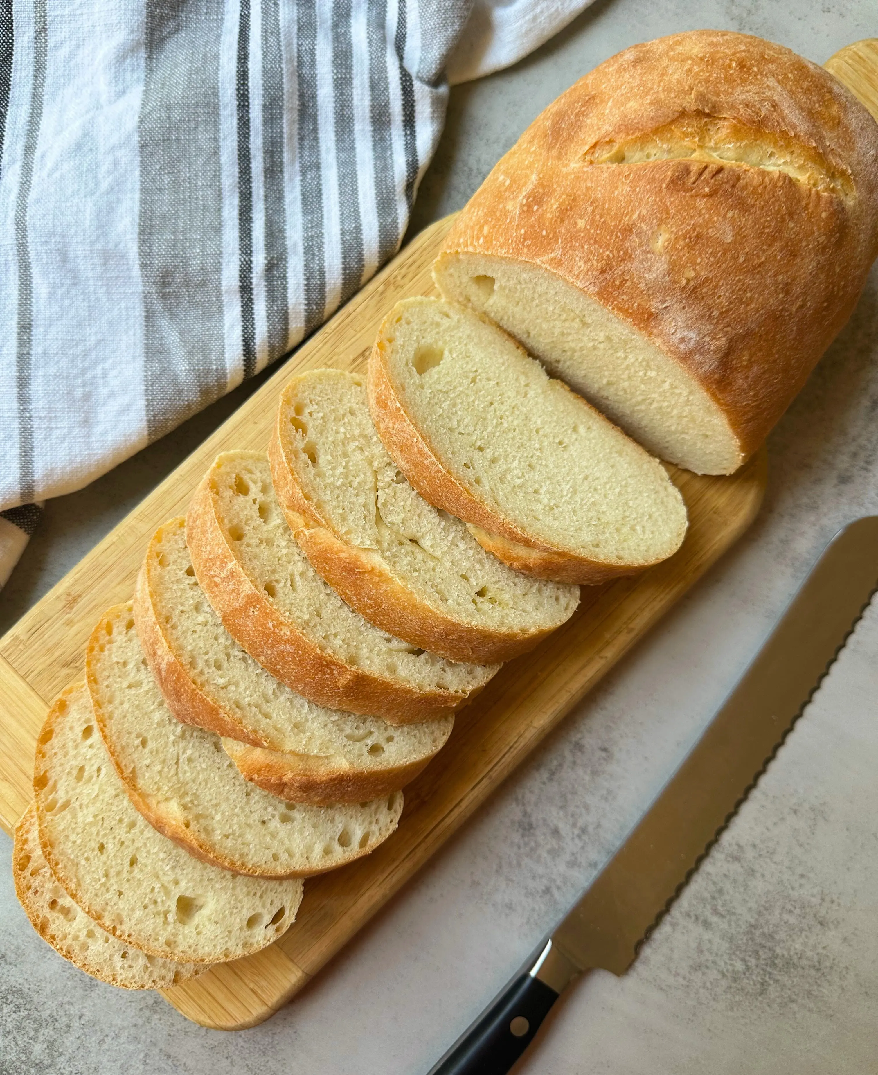finished vegan Italian bread sliced on a cutting board