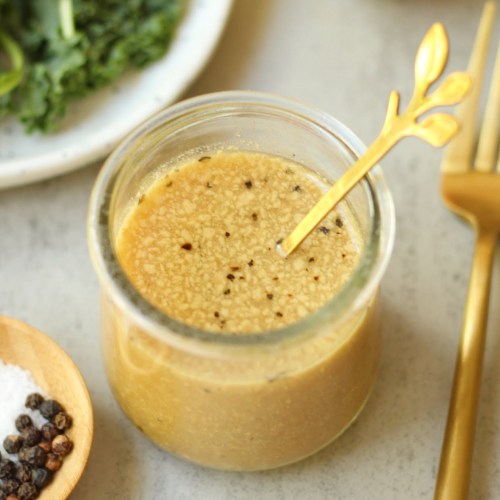 oil-free apple cider vinaigrette dressing in a glass container