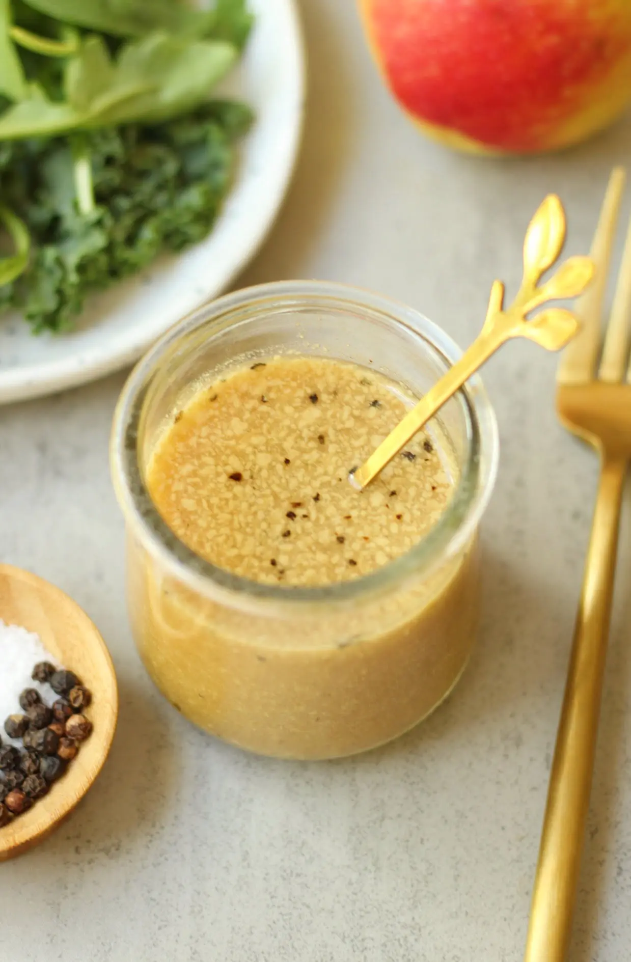 oil-free apple cider vinaigrette dressing in a glass container