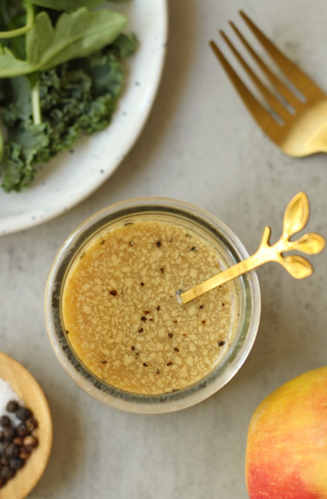 top view oil-free apple cider vinaigrette in a glass container
