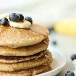 stack of banana oat pancakes with syrup running down