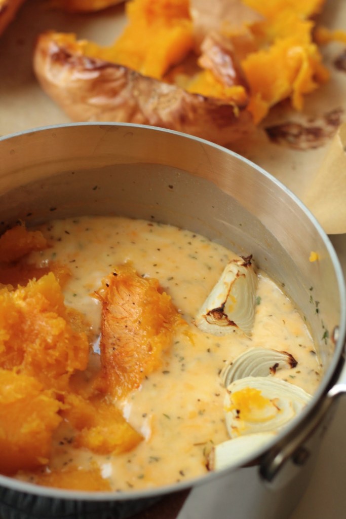 cooked butternut squash and onions in the vegan cheese sauce