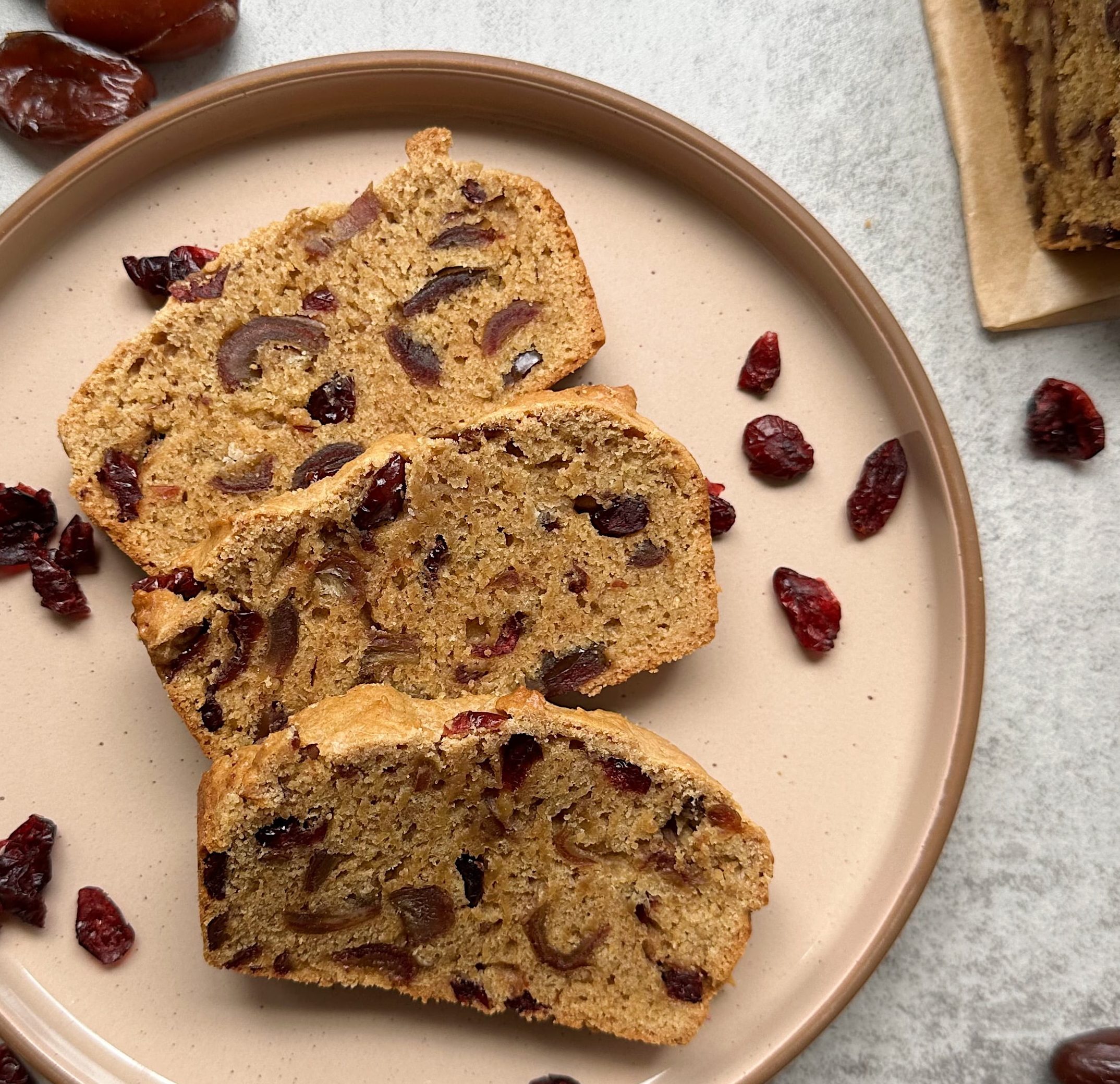 finished slices of cranberry date bread on a plate